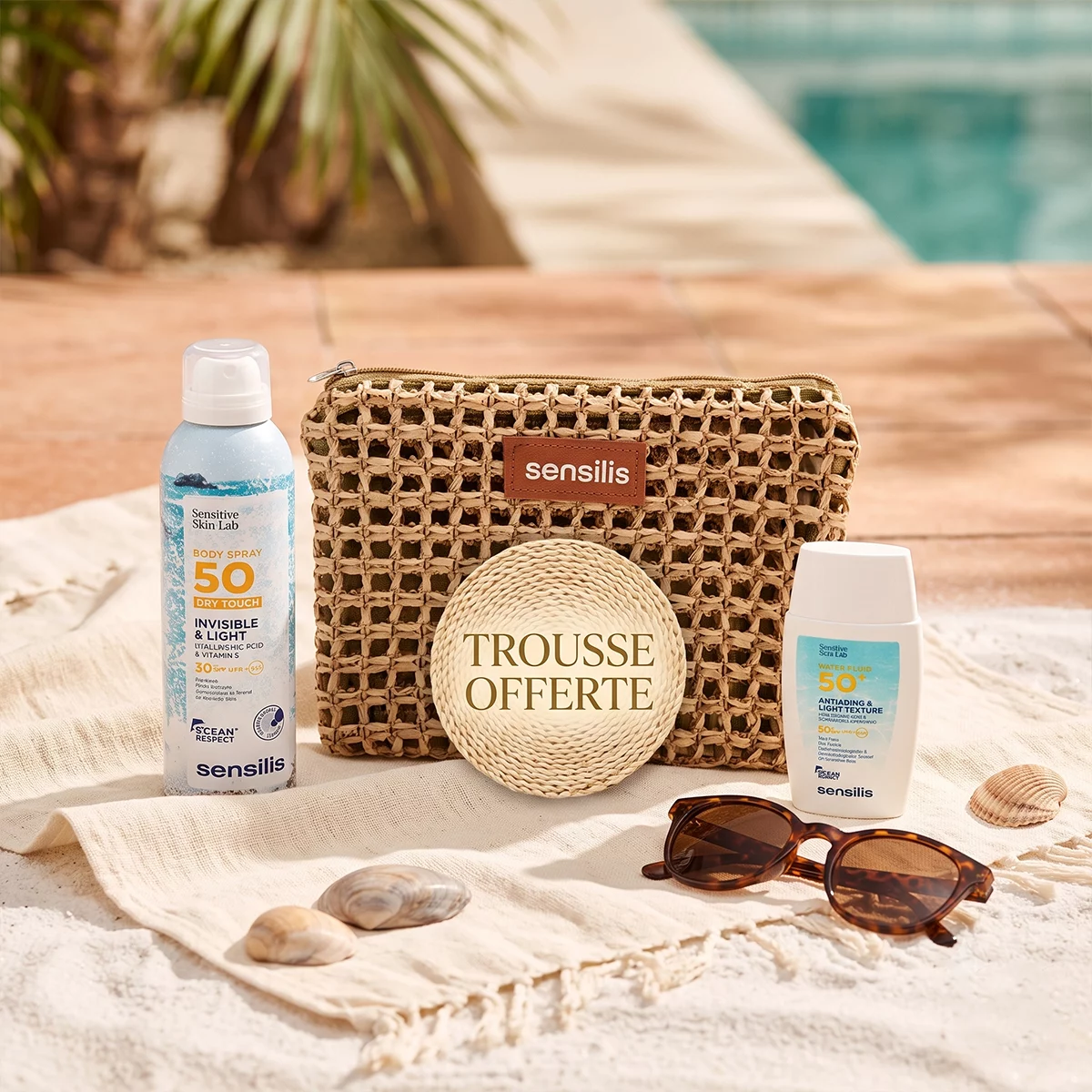 Crème solaire Sensilis, lunettes de soleil et trousse.